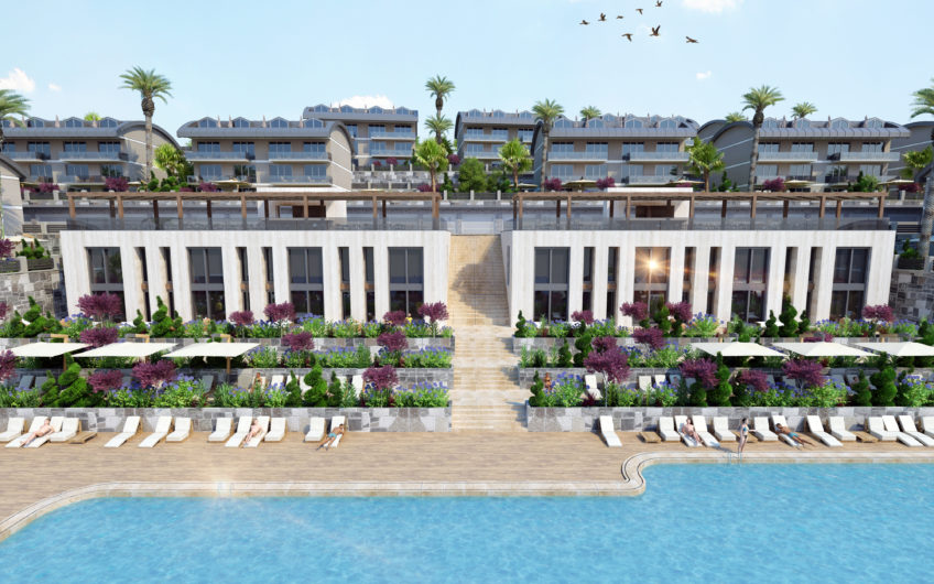 Rummelige lejligheder med havudsigt i et boligkompleks med stort grønt område