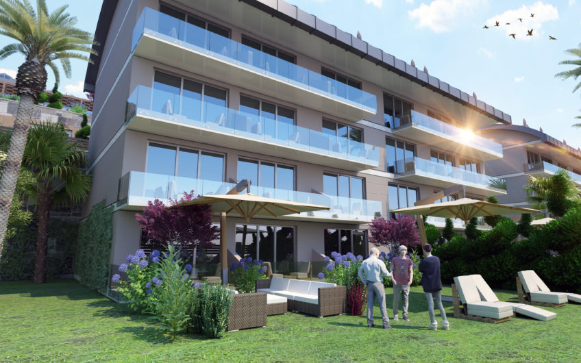 Rummelige lejligheder med havudsigt i et boligkompleks med stort grønt område