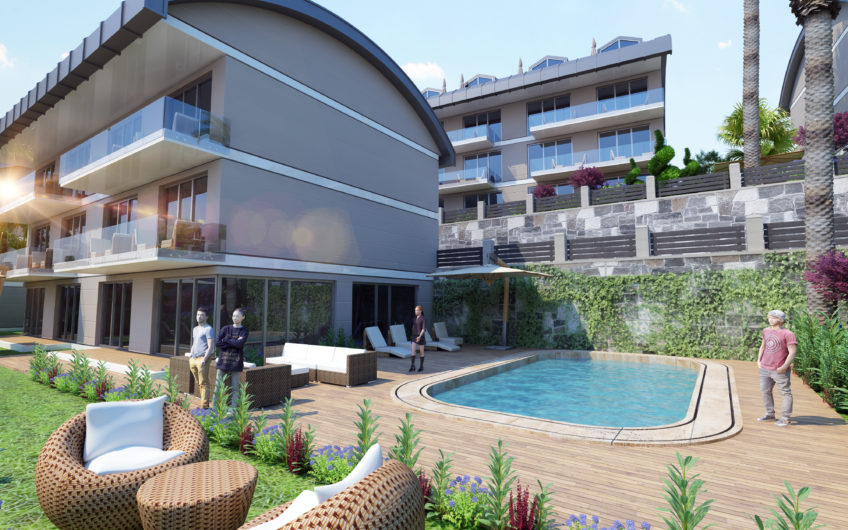 Rummelige lejligheder med havudsigt i et boligkompleks med stort grønt område