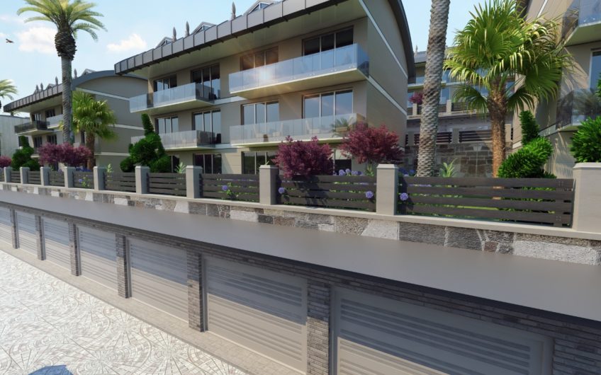 Rummelige lejligheder med havudsigt i et boligkompleks med stort grønt område