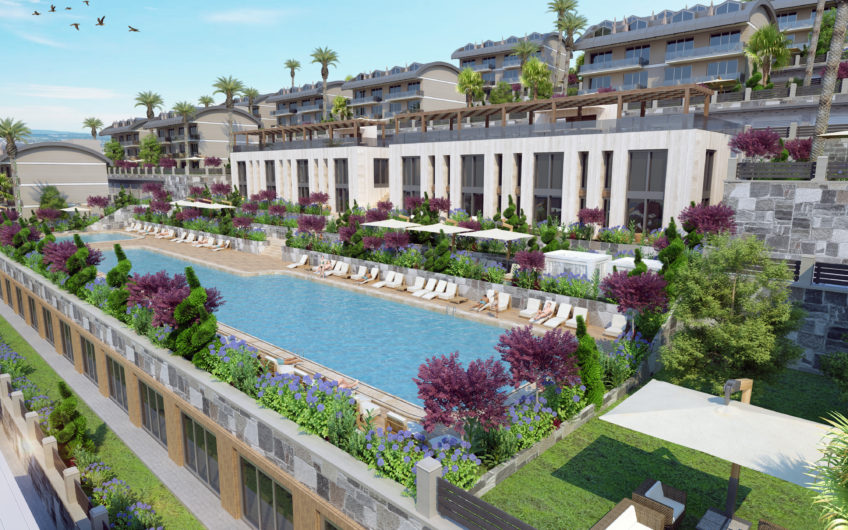 Rummelige lejligheder med havudsigt i et boligkompleks med stort grønt område