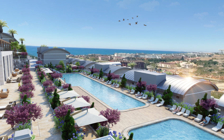 Rummelige lejligheder med havudsigt i et boligkompleks med stort grønt område