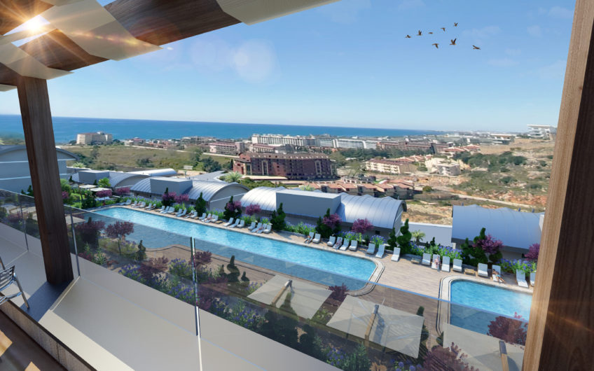 Rummelige lejligheder med havudsigt i et boligkompleks med stort grønt område